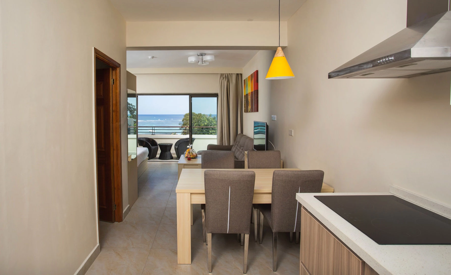 Modern apartment with kitchen area, dining space and sea-view balcony at Residence Potosi